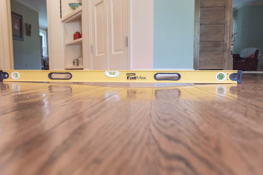 Measuring sagging wood floors in home