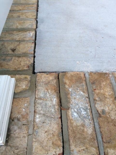 Concrete patio gap between brick