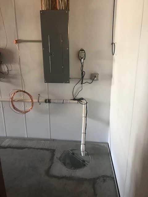 New basement sump pump in the corner