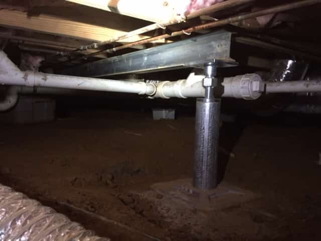 steel supplemental beam in crawl space around pipe